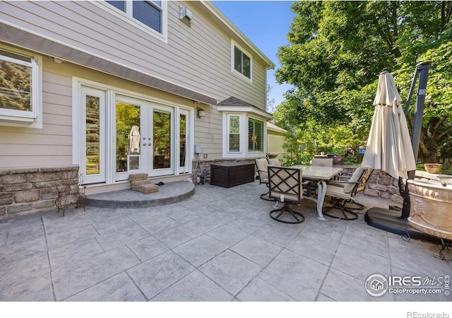 1892 Bell Dr, Erie, CO 80516 - view of patio / terrace featuring outdoor dining space and french doors