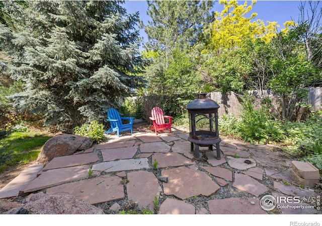 1892 Bell Dr, Erie, CO 80516 - view of patio featuring a fire pit