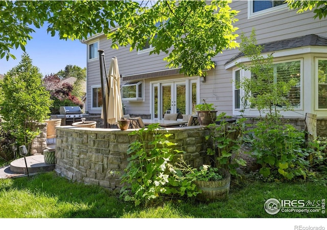 1892 Bell Dr, Erie, CO 80516 - rear view of house featuring french doors and a patio area