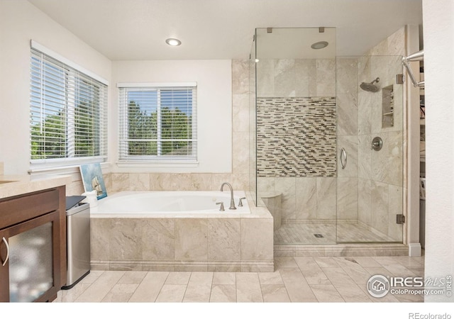 1892 Bell Dr, Erie, CO 80516 - full bath with a garden tub, a shower stall, and vanity