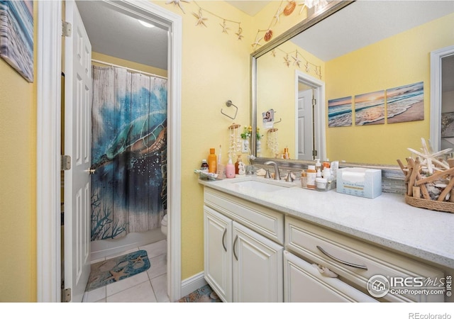 1892 Bell Dr, Erie, CO 80516 - bathroom with toilet, vanity, tile patterned floors, and a shower with shower curtain