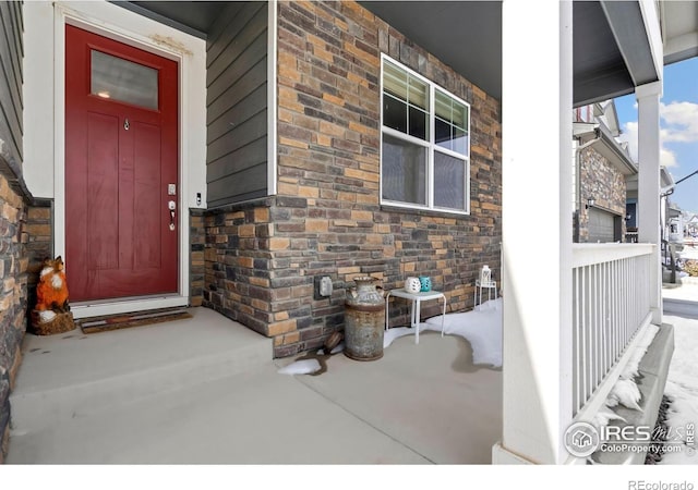 296 Swallow Rd, Johnstown, CO 80534 - entrance to property with covered porch and stone siding