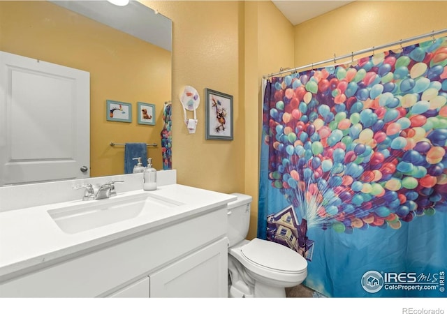 296 Swallow Rd, Johnstown, CO 80534 - bathroom with vanity, toilet, and curtained shower