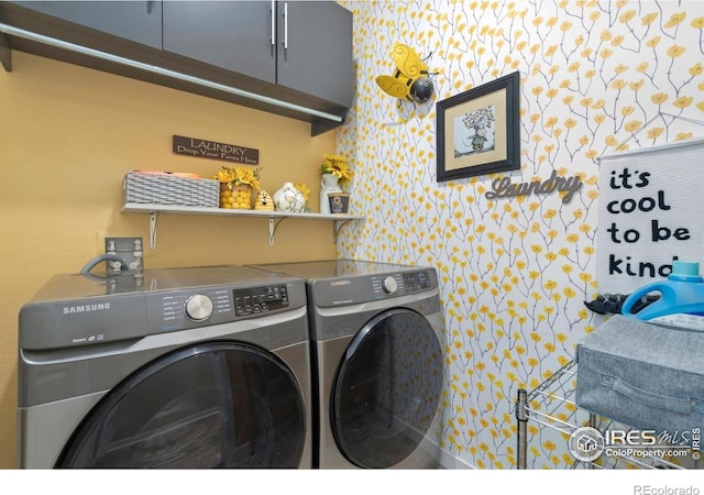 296 Swallow Rd, Johnstown, CO 80534 - washroom with cabinet space, independent washer and dryer, and wallpapered walls