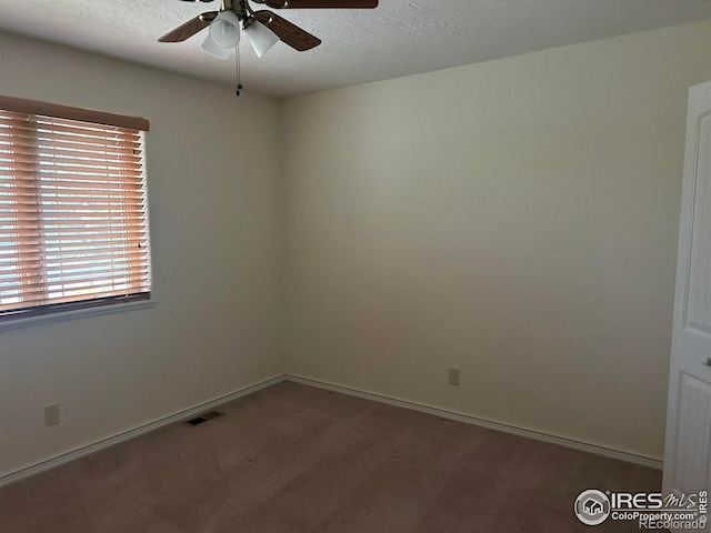 33180 Pikes Peak Dr, Greeley, CO 80631 - carpeted empty room with a ceiling fan, baseboards, and a textured ceiling
