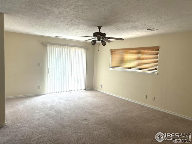 33180 Pikes Peak Dr, Greeley, CO 80631 - carpeted empty room featuring a ceiling fan, baseboards, and a textured ceiling