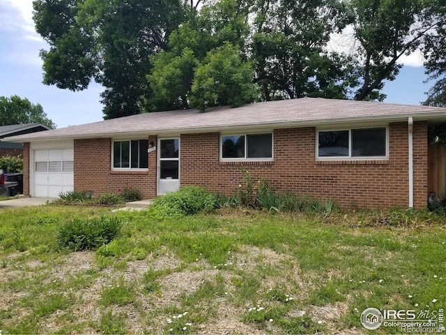 829 Hubbard Dr, Longmont, CO 80504 - ranch-style home featuring a garage and brick siding