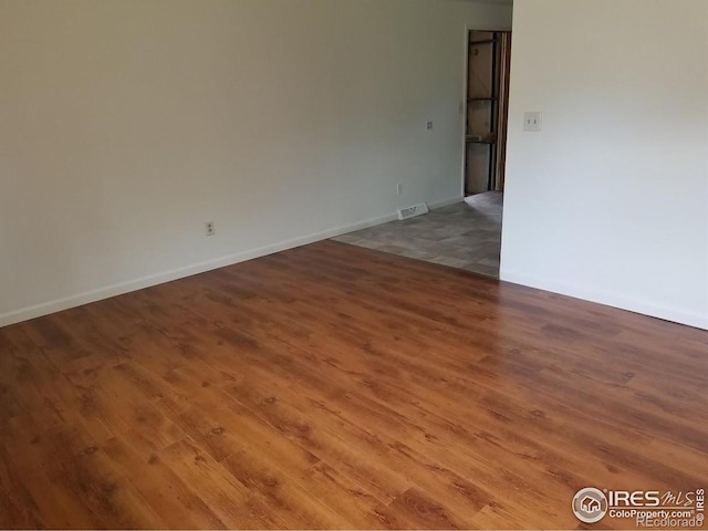 829 Hubbard Dr, Longmont, CO 80504 - empty room featuring wood finished floors and baseboards