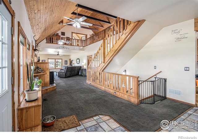 39445 Main St, Eaton, CO 80615 - unfurnished living room with a ceiling fan, carpet flooring, high vaulted ceiling, and wood ceiling