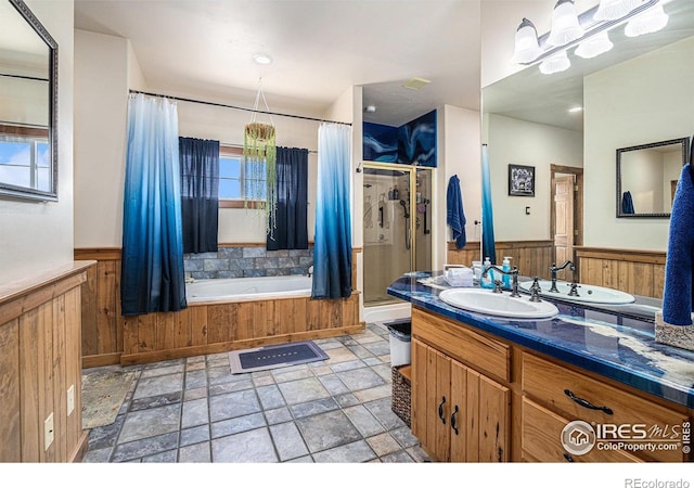 39445 Main St, Eaton, CO 80615 - full bathroom featuring a stall shower, wainscoting, a garden tub, stone finish floors, and vanity