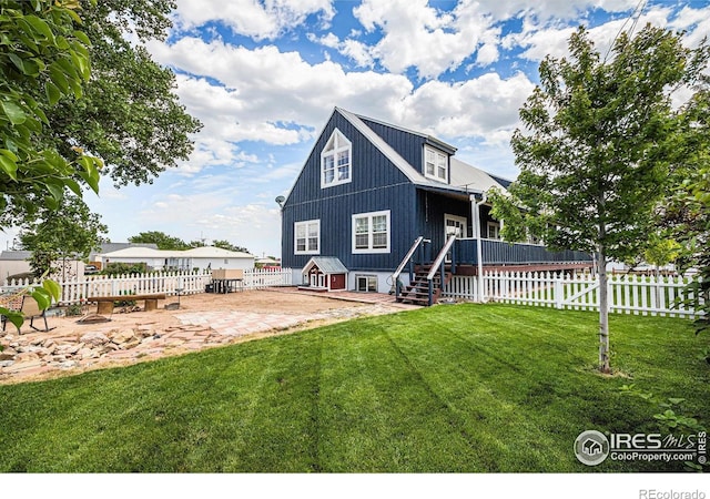 39445 Main St, Eaton, CO 80615 - rear view of property with a patio, a fenced backyard, stairs, and a wooden deck