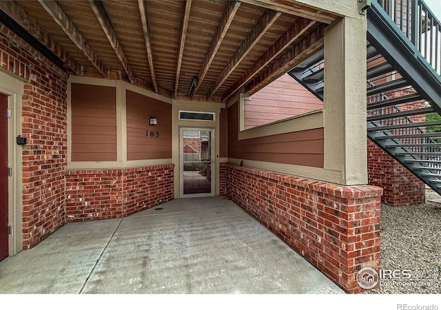 804 Summer Hawk Dr Unit 105, Longmont, CO 80504 - doorway to property with brick siding
