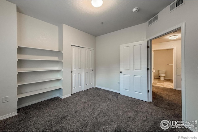 804 Summer Hawk Dr Unit 105, Longmont, CO 80504 - unfurnished bedroom featuring carpet, a closet, and baseboards