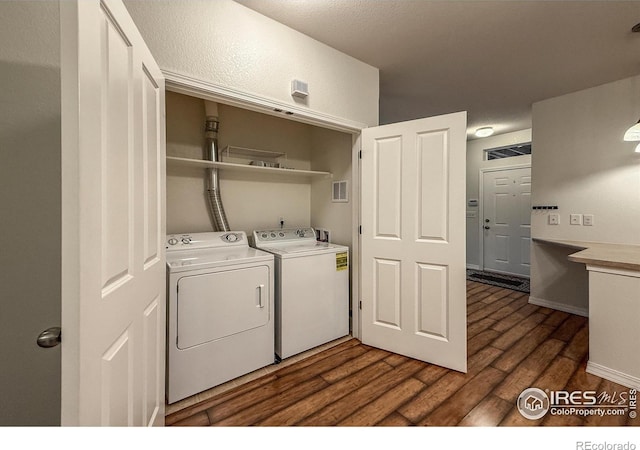 804 Summer Hawk Dr Unit 105, Longmont, CO 80504 - laundry area with separate washer and dryer and dark wood-style floors
