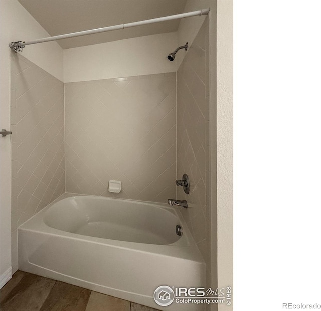 804 Summer Hawk Dr Unit 105, Longmont, CO 80504 - bathroom with bathtub / shower combination and tile patterned flooring