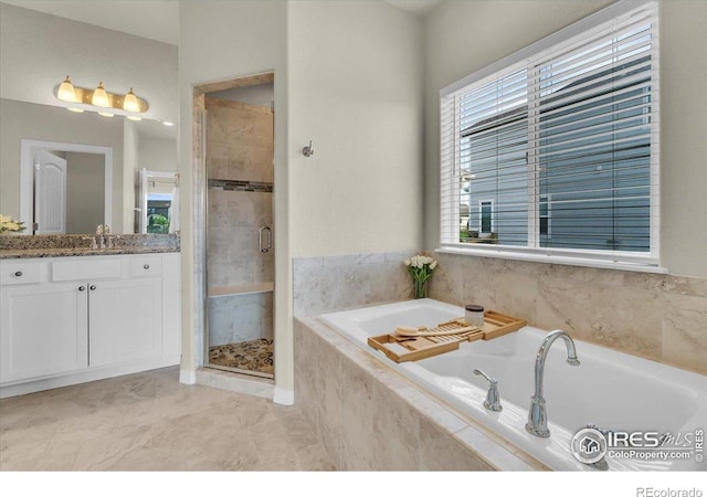 1368 Waterfall St, Timnath, CO 80547 - full bathroom with vanity, a stall shower, and a garden tub