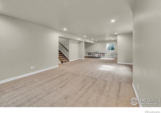 1368 Waterfall St, Timnath, CO 80547 - below grade area featuring recessed lighting, carpet flooring, stairs, and baseboards