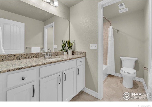 1368 Waterfall St, Timnath, CO 80547 - bathroom featuring vanity, toilet, shower / tub combo with curtain, baseboards, and tile patterned floors