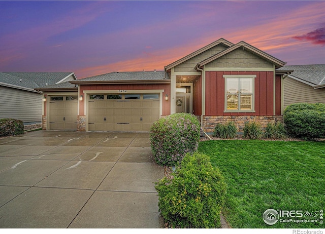 5434 Wishing Well Dr, Timnath, CO 80547 - ranch-style home with stone siding, board and batten siding, an attached garage, and driveway