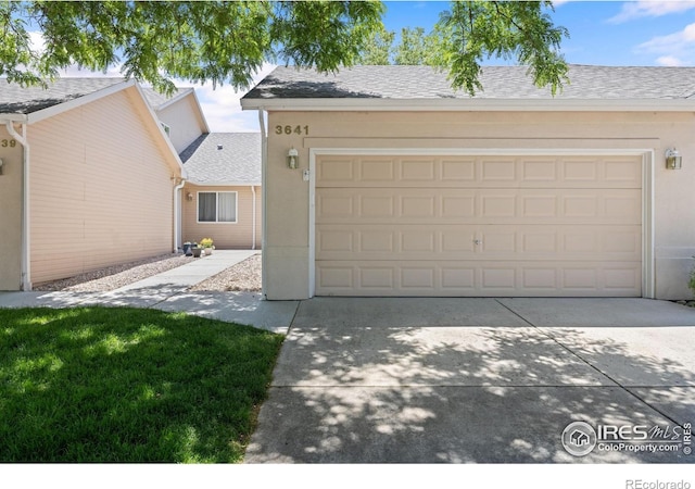 3641 Wild Horse Ct, Loveland, CO 80538 - view of front facade featuring concrete driveway, a garage, and a shingled roof