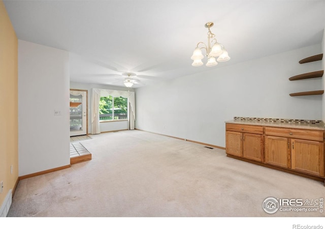 3641 Wild Horse Ct, Loveland, CO 80538 - unfurnished room featuring a ceiling fan, light carpet, baseboards, and a chandelier