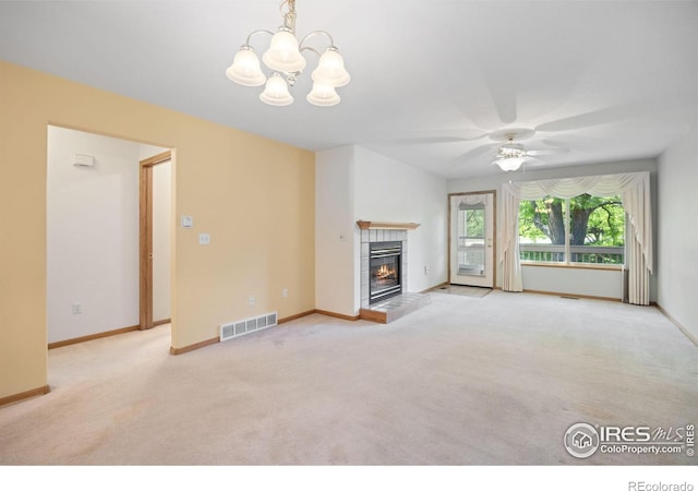 3641 Wild Horse Ct, Loveland, CO 80538 - unfurnished living room with carpet, a chandelier, a tiled fireplace, and baseboards