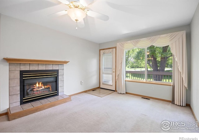 3641 Wild Horse Ct, Loveland, CO 80538 - unfurnished living room featuring a fireplace, carpet, baseboards, and a ceiling fan