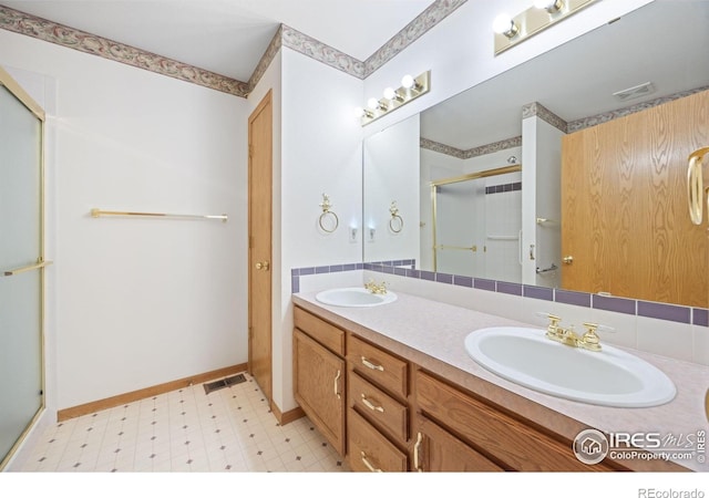 3641 Wild Horse Ct, Loveland, CO 80538 - full bathroom with tile patterned floors, a shower stall, and double vanity
