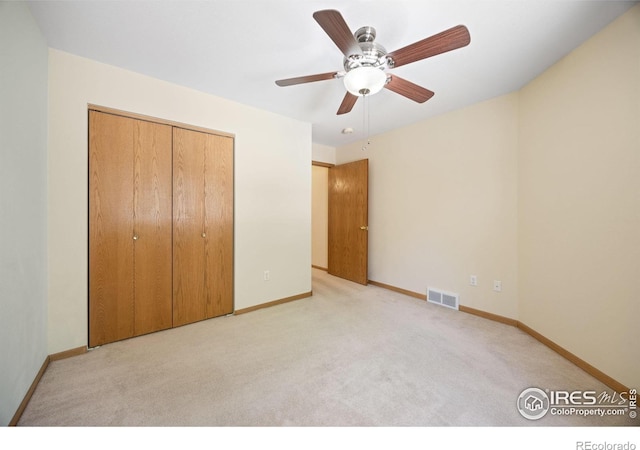 3641 Wild Horse Ct, Loveland, CO 80538 - unfurnished bedroom with light carpet, baseboards, a closet, and a ceiling fan
