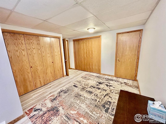 1722 Pheasant Rdg, Sterling, CO 80751 - unfurnished bedroom featuring wood finished floors, a drop ceiling, and a closet