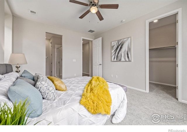 17871 E 96th Pl, Commerce City, CO 80022 - carpeted bedroom featuring a walk in closet, a closet, baseboards, and ceiling fan