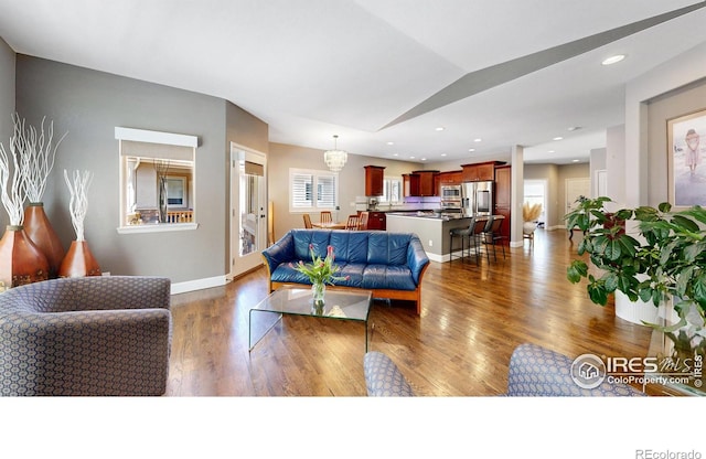 6945 N Fargo Trl, Littleton, CO 80125 - living area with dark wood-type flooring and baseboards