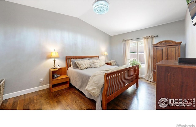 6945 N Fargo Trl, Littleton, CO 80125 - bedroom featuring lofted ceiling and wood finished floors