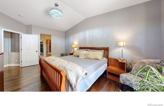 6945 N Fargo Trl, Littleton, CO 80125 - bedroom with lofted ceiling and wood finished floors