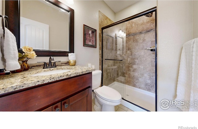 6945 N Fargo Trl, Littleton, CO 80125 - bathroom featuring vanity and tiled shower