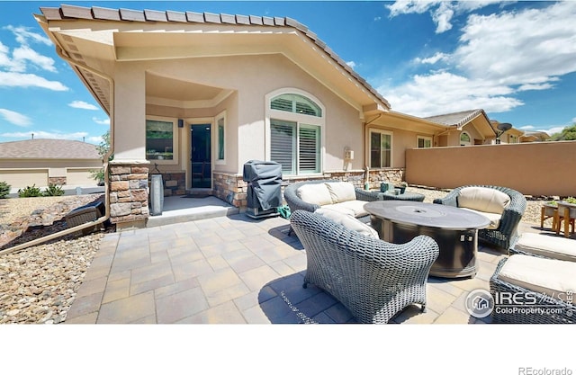 6945 N Fargo Trl, Littleton, CO 80125 - view of patio featuring a grill and an outdoor living space