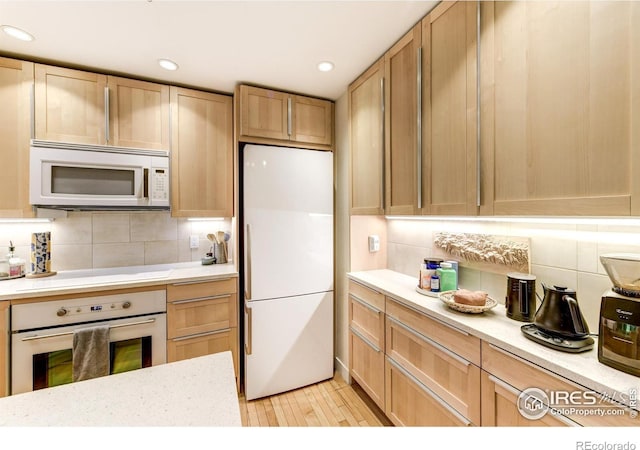 812 Walnut St Unit D, Boulder, CO 80302 - kitchen with white appliances, tasteful backsplash, recessed lighting, and light brown cabinets
