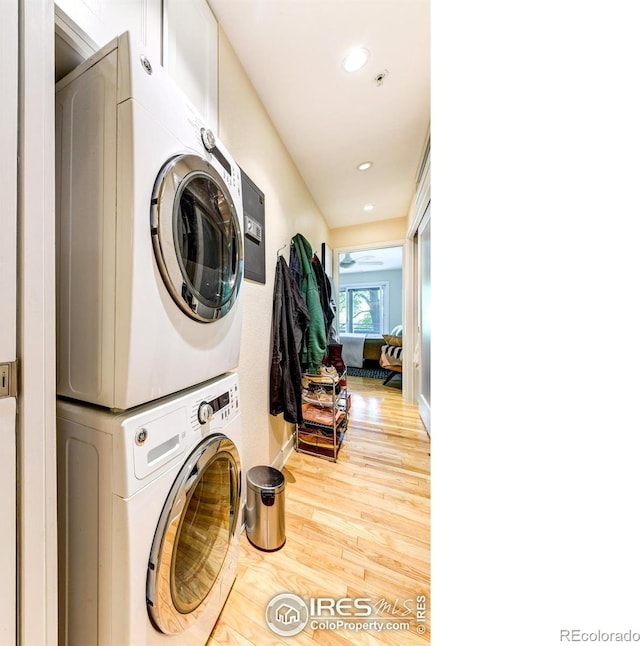 812 Walnut St Unit D, Boulder, CO 80302 - laundry room with stacked washing machine and dryer, wood finished floors, and recessed lighting