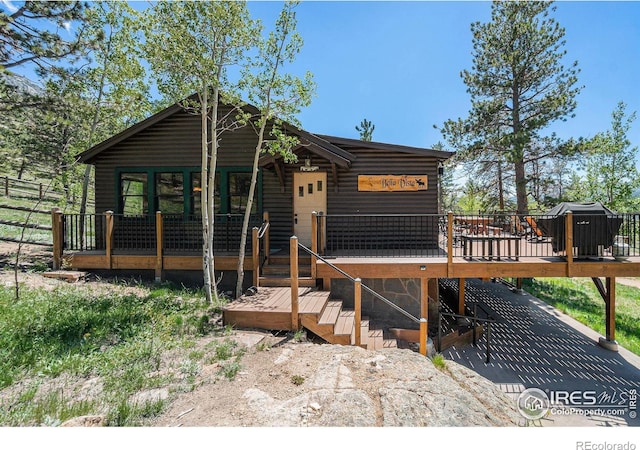 6600 State Highway 7, Estes Park, CO 80517 - rustic home with a deck