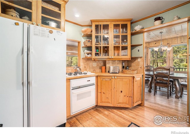 6600 State Highway 7, Estes Park, CO 80517 - kitchen with white appliances, open shelves, crown molding, light countertops, and light wood finished floors