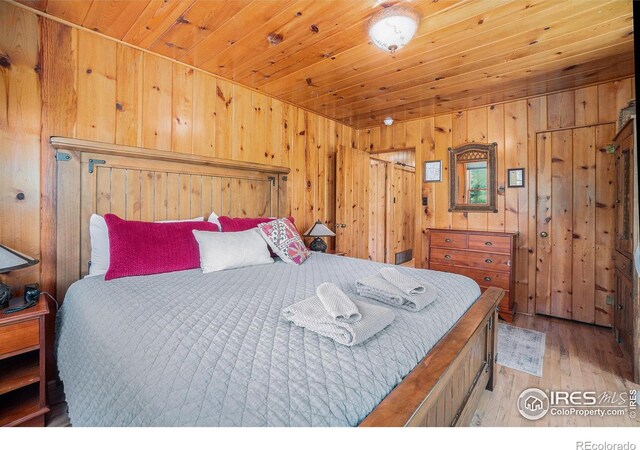 6600 State Highway 7, Estes Park, CO 80517 - bedroom featuring wooden ceiling, wood finished floors, and wood walls