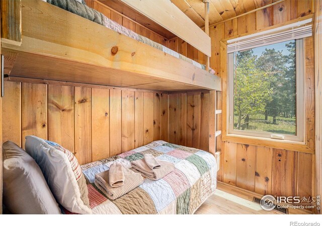 6600 State Highway 7, Estes Park, CO 80517 - bedroom with wood walls and wood finished floors