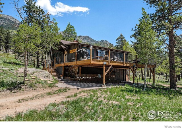 6600 State Highway 7, Estes Park, CO 80517 - back of house featuring a deck with mountain view and stairway