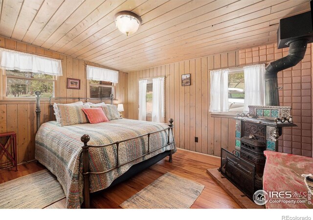 6600 State Highway 7, Estes Park, CO 80517 - bedroom featuring wood ceiling, wood finished floors, wood walls, and baseboards