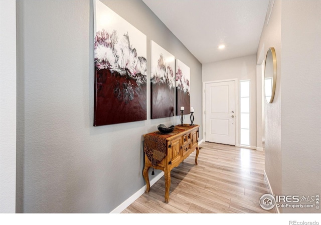 1191 Horsetail Loop, Elizabeth, CO 80107 - corridor with light wood finished floors, baseboards, a textured wall, and recessed lighting
