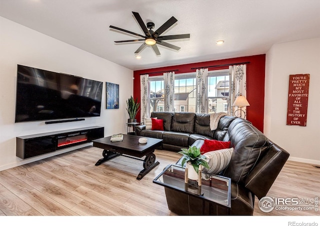 1191 Horsetail Loop, Elizabeth, CO 80107 - living room with a ceiling fan, light wood-style flooring, baseboards, and recessed lighting