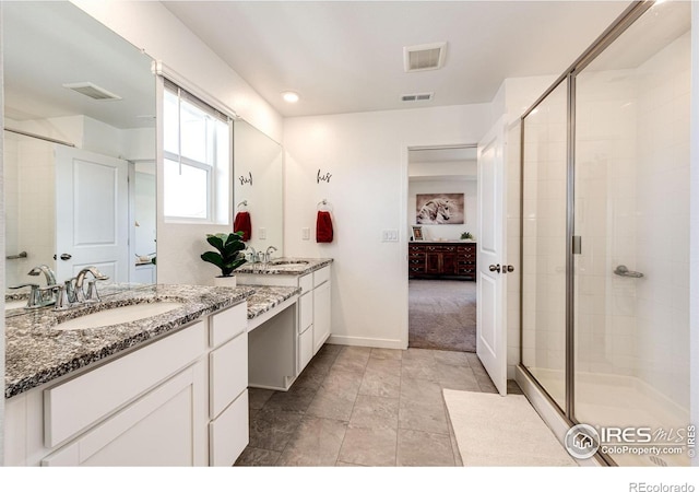 1191 Horsetail Loop, Elizabeth, CO 80107 - bathroom with ensuite bath, a stall shower, two vanities, baseboards, and recessed lighting