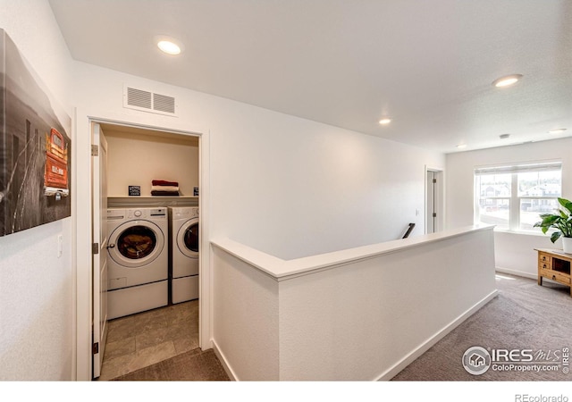 1191 Horsetail Loop, Elizabeth, CO 80107 - corridor featuring washer and dryer, an upstairs landing, and recessed lighting