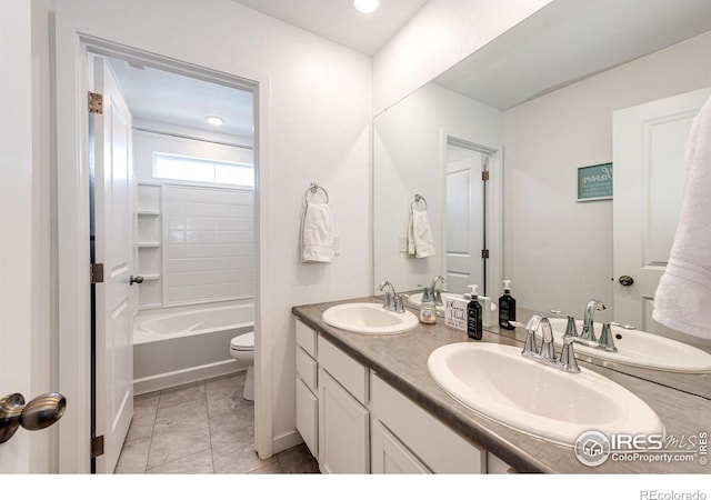1191 Horsetail Loop, Elizabeth, CO 80107 - bathroom featuring toilet, double vanity, tile patterned flooring, and bathing tub / shower combination