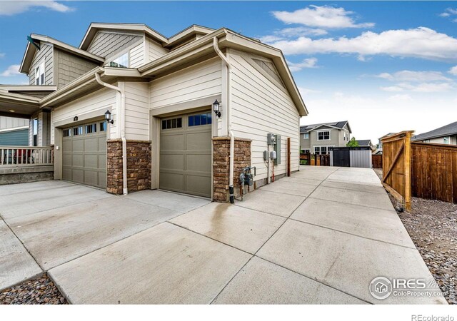 1191 Horsetail Loop, Elizabeth, CO 80107 - view of property exterior featuring driveway and stone siding